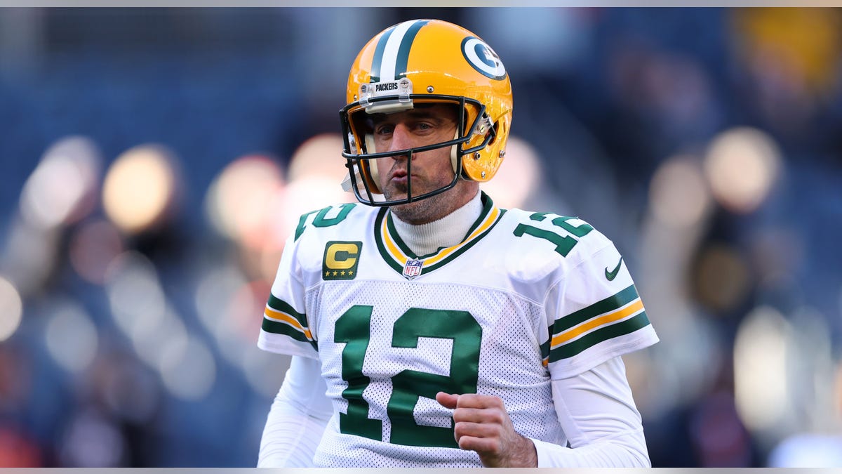 Aaron Rodgers runs on field