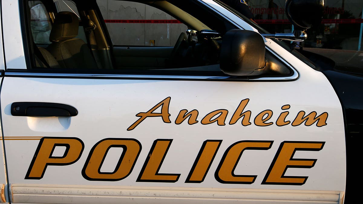 An Anaheim police patrol car seen at a crime scene during daytime