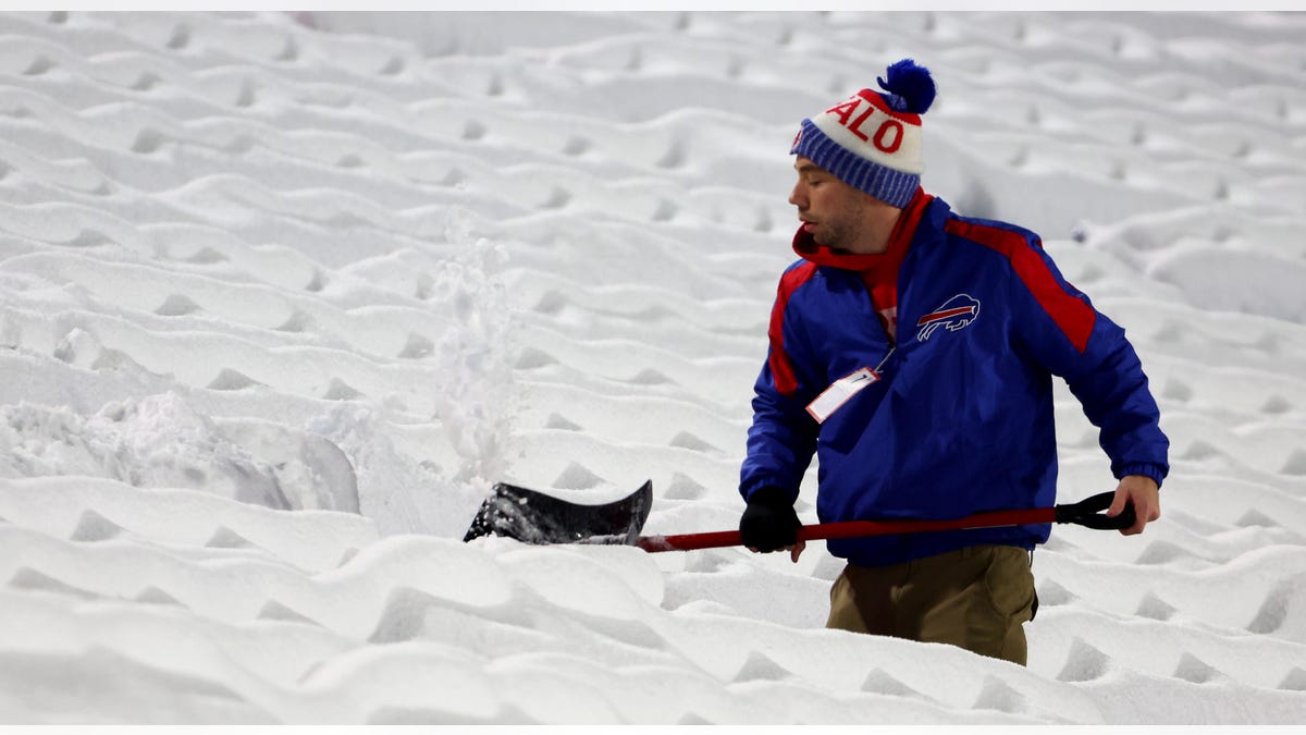Bills staffer shovels snow