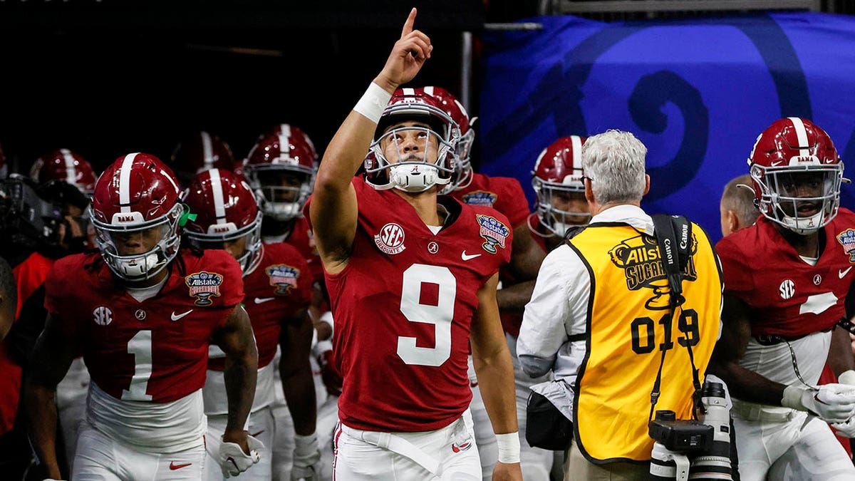 Alabama quarterback Bryce Young (9) leads the team onto the field before the start of the Sugar Bowl NCAA college football game against Kansas State Saturday, Dec. 31, 2022, in New Orleans.