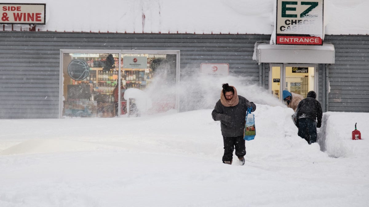 A resident leaves a local corner store in Buffalo, New York, on December 26, 2022, as many major grocery stores remained closed.