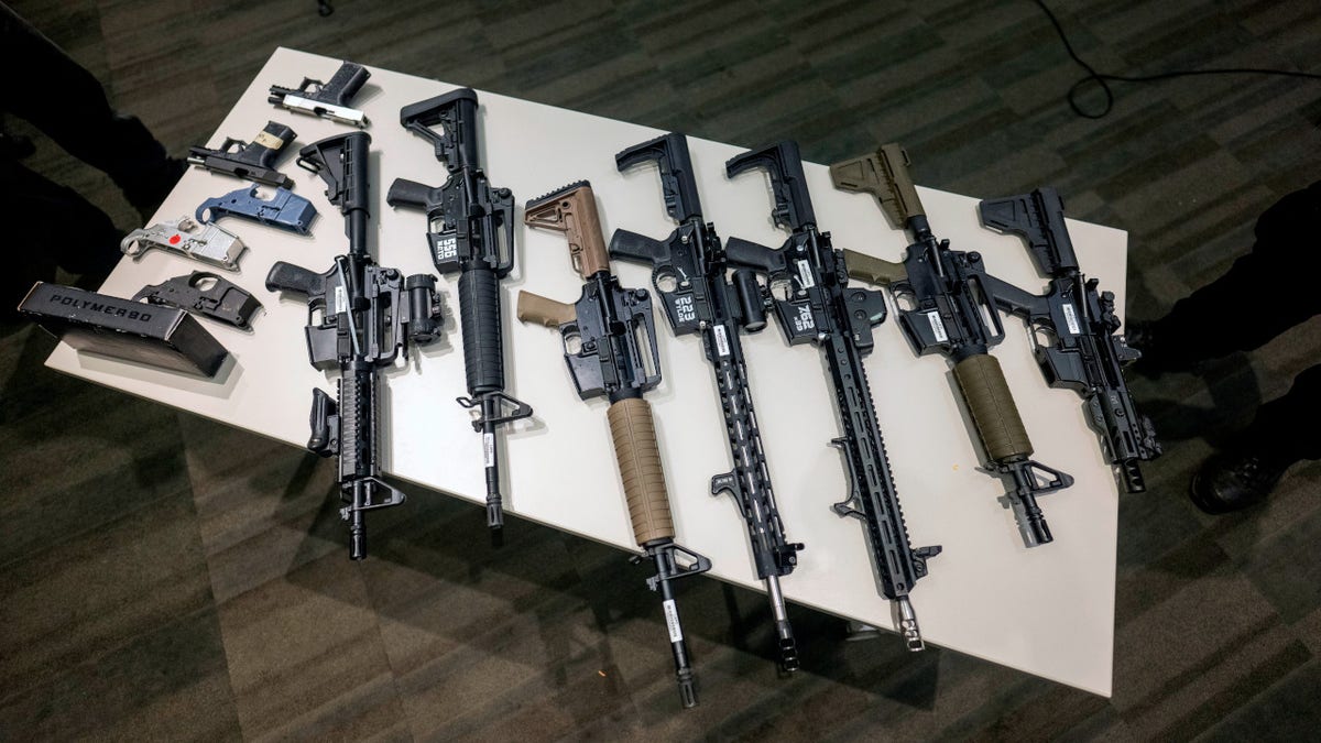 Los Angeles Police display seized ghost guns on a table