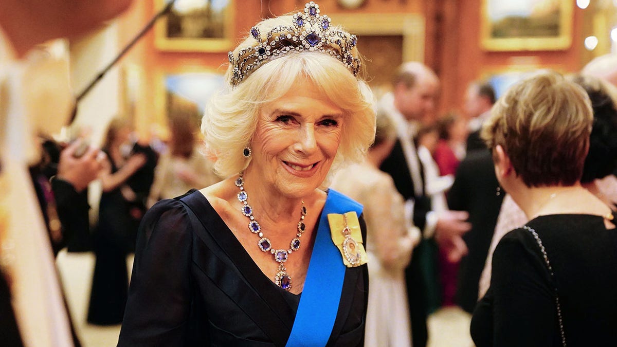 Camilla smiling while wearing a tiara
