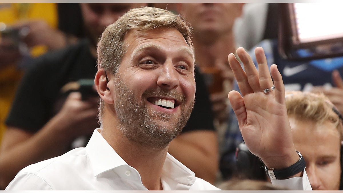 Dirk Nowitzki smiling in stands