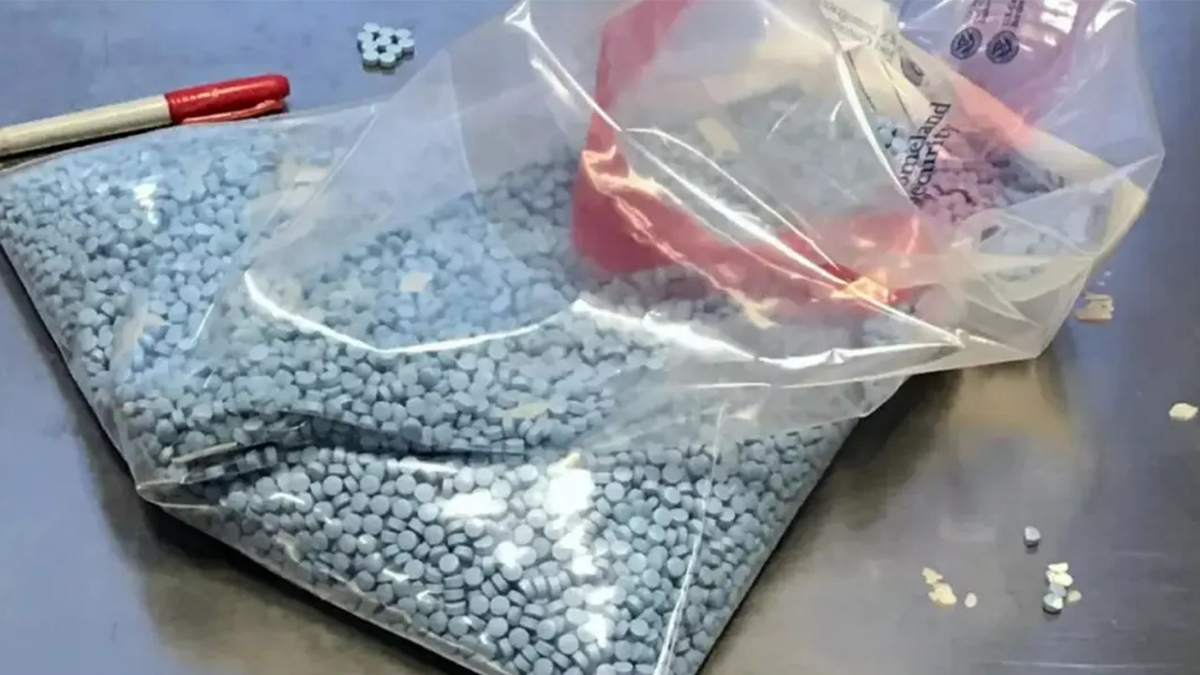Blue fentanyl pills in a plastic bag