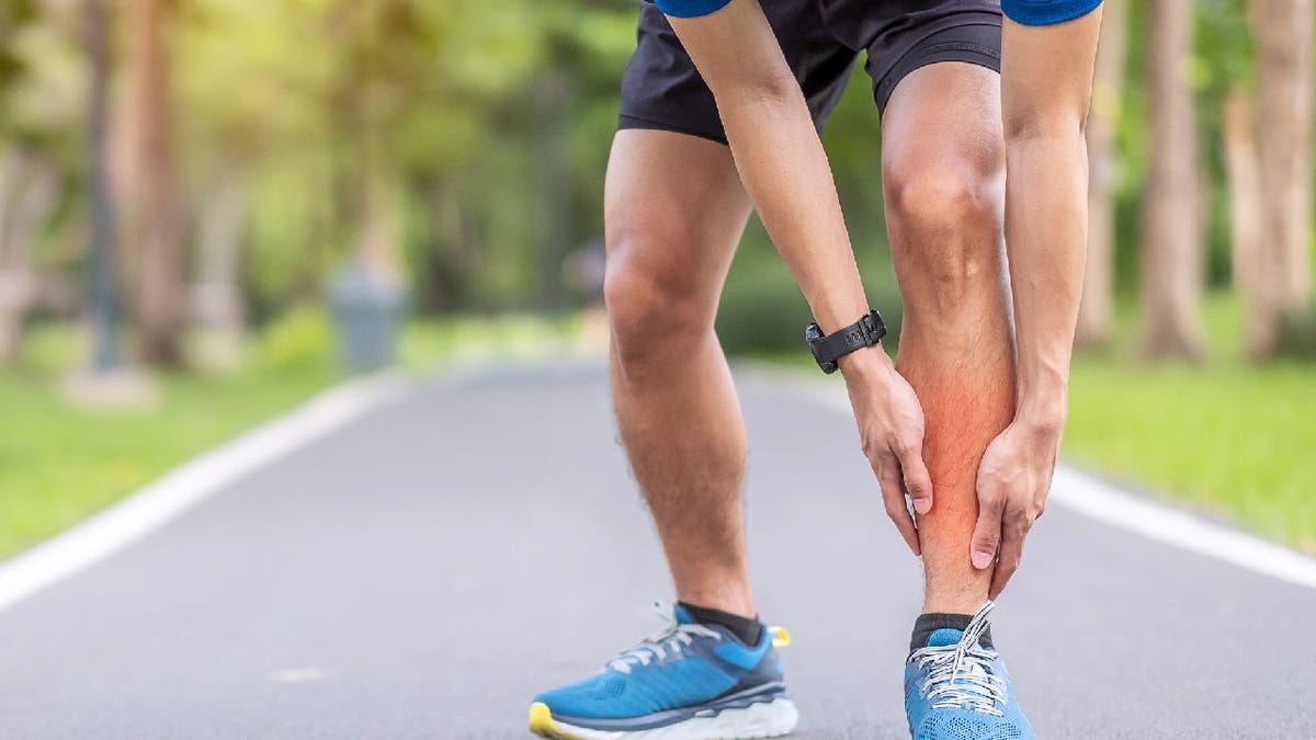 Man suffers shin splint or lower leg pain