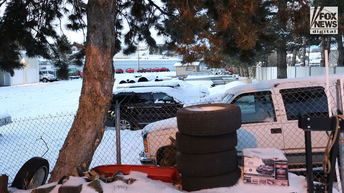 snow covers cars of murder victims