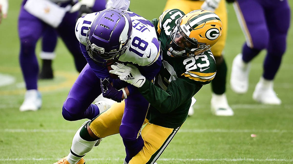 Jaire Alexander tackling Justin Jefferson