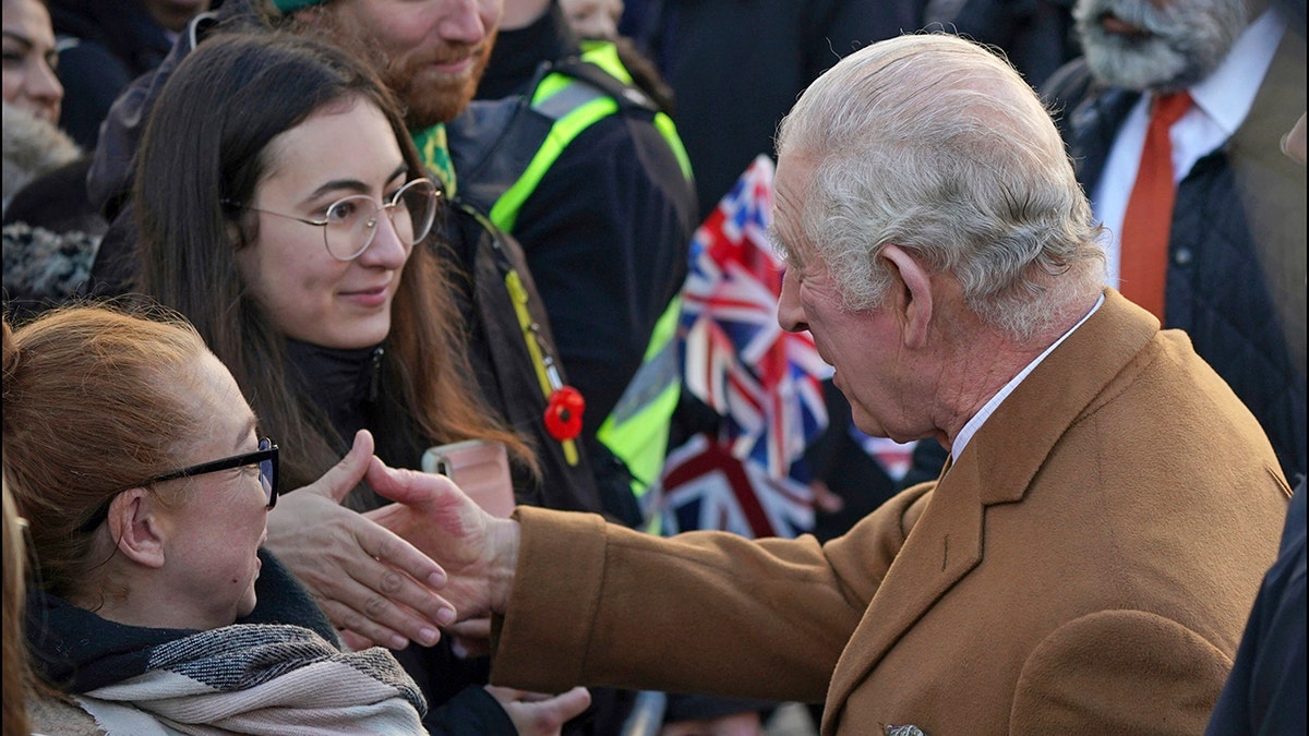 King Charles II shaking hands