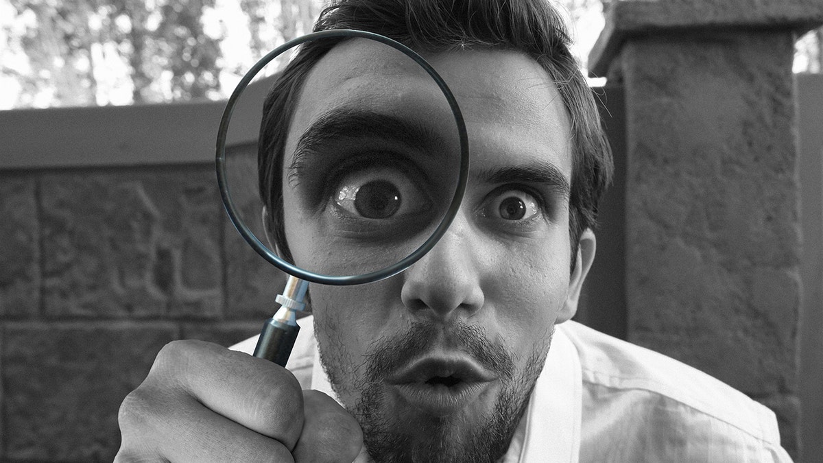 Man with magnifying glass