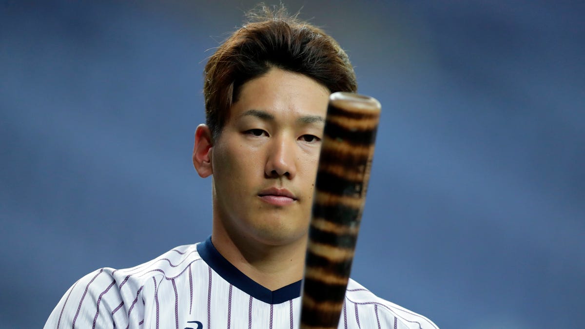 Masataka Yoshida stares at bat