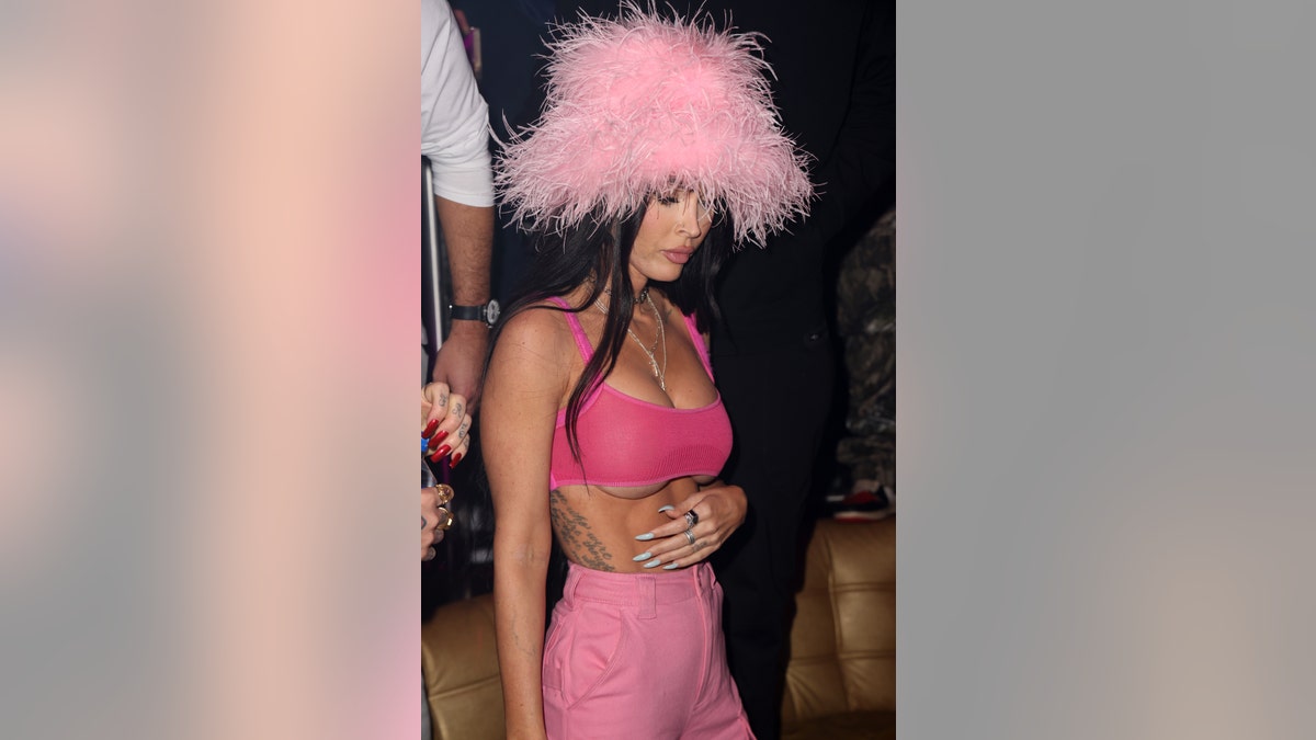 Megan Fox wears a pink hat