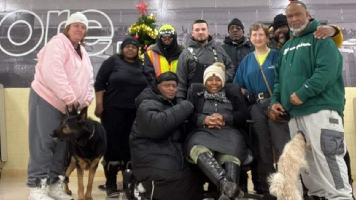 Jay Withey is pictured with several of the people he rescued from the deadly winter storm.