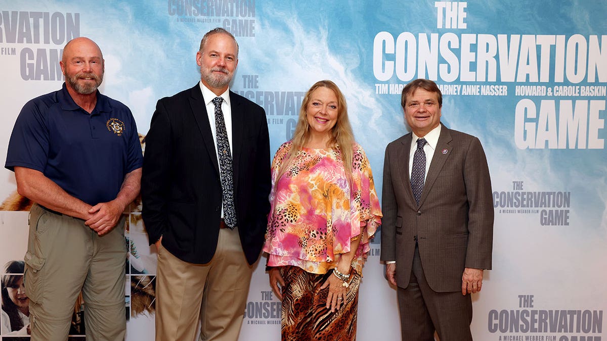 Rep. Mike Quigley stands alongside Carole Baskin while at a film screening