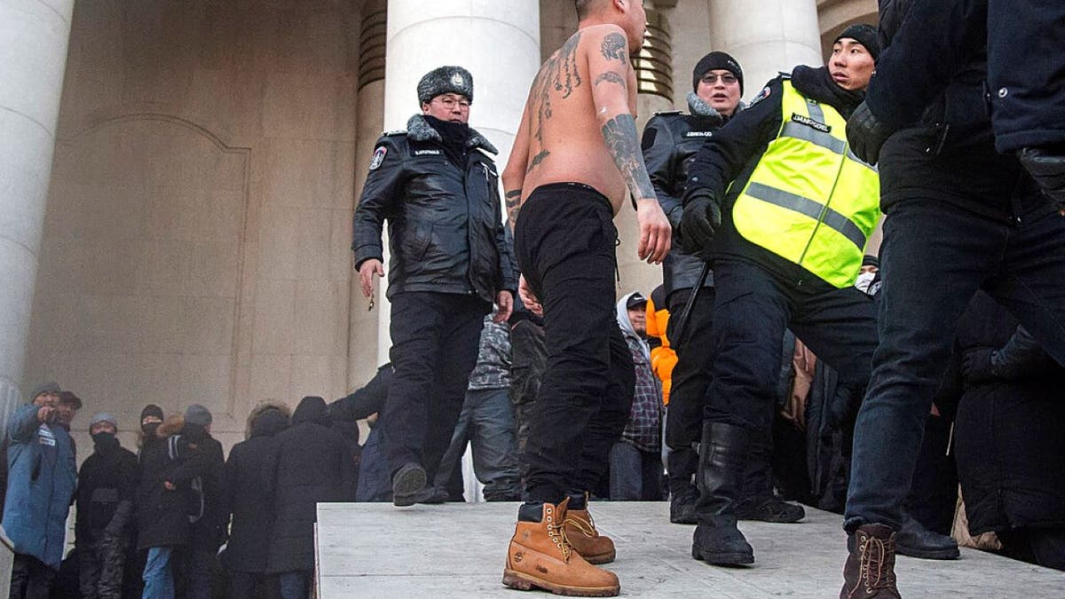 Mongolia protester interacts with police