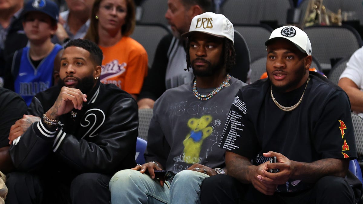 Odell Beckham Jr., Trevon Diggs and Micah Parsons sit courtside