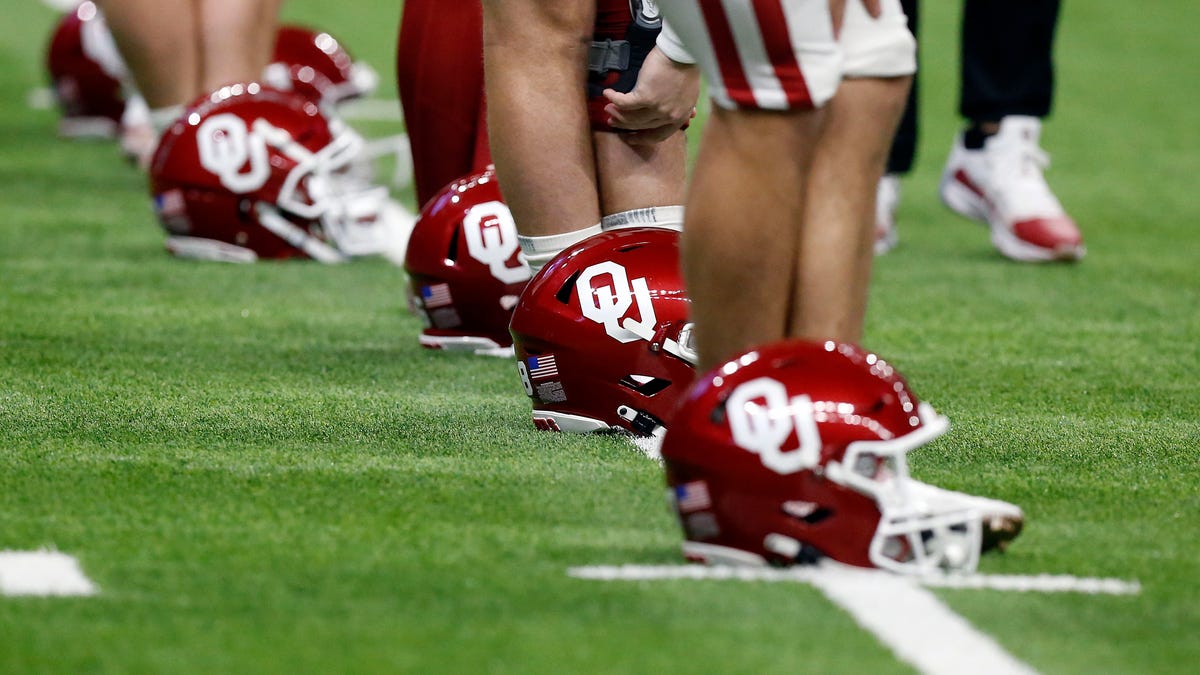 Oklahoma helmets lined up on field