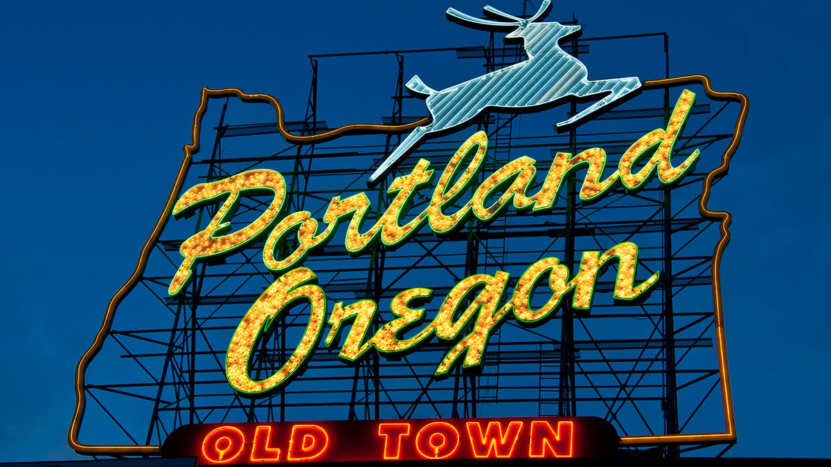 Portland Oregon Old Town sign lit up at dusk