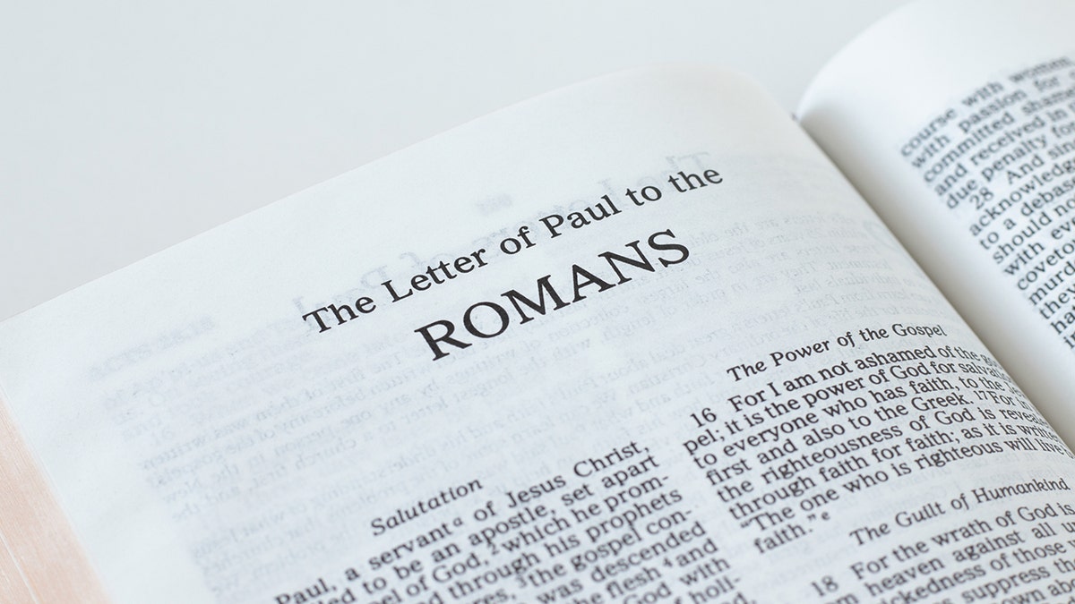 Bible opened to Romans