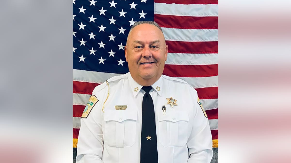 Moore County Sheriff Ronnie Fields smiles for department photo