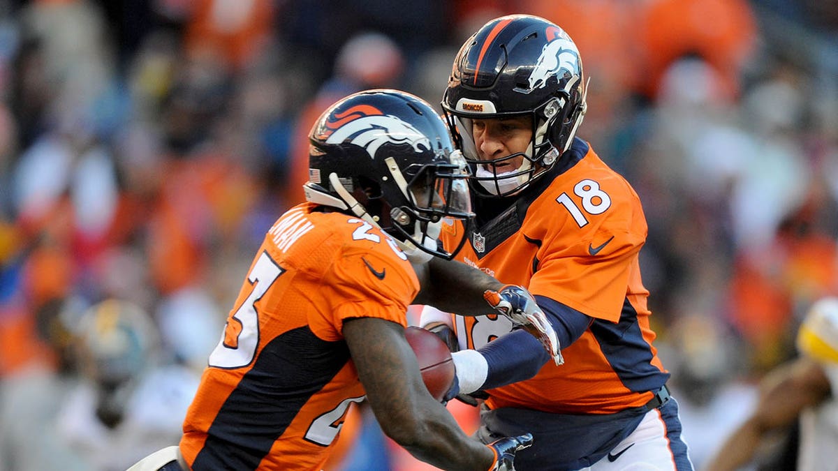 Peyton Manning #18 of the Denver Broncos hands off to Ronnie Hillman #23 of the Denver Broncos during the AFC Divisional Playoff Game against the Pittsburgh Steelers at Sports Authority Field at Mile High on January 17, 2016 in Denver, Colorado.