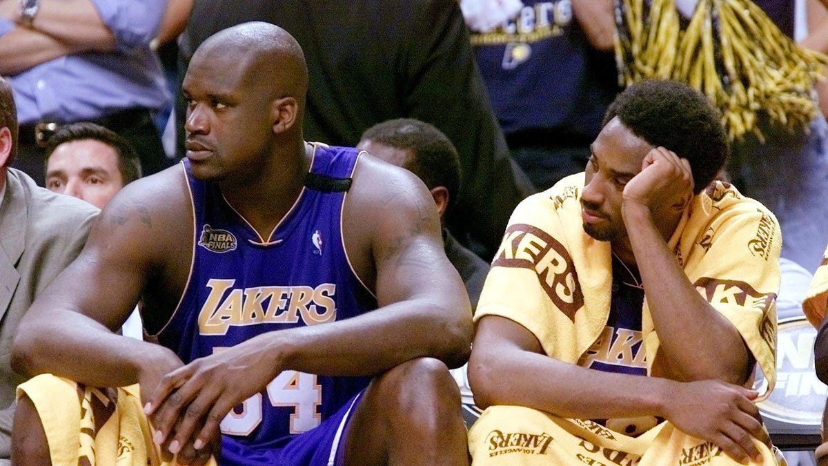 Shaquille O'Neal and Kobe Bryant sitting