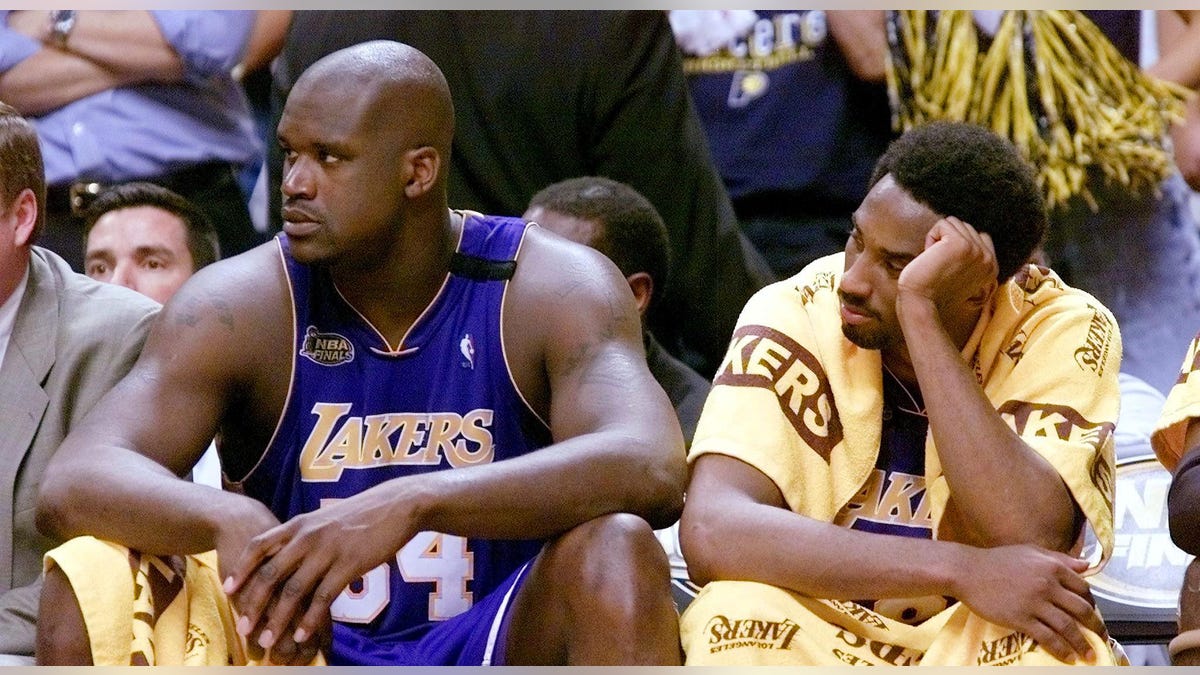 Shaquille O'Neal and Kobe Bryant sitting