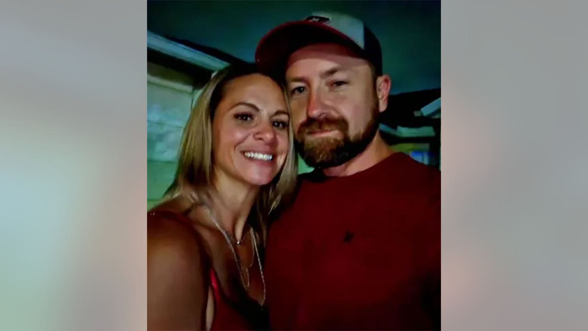 Nicole Foltz smiles with husband at tavern