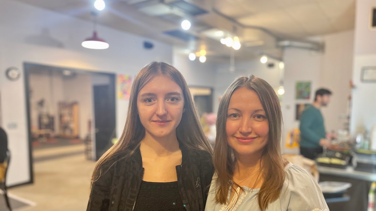 A mother and daughter from Ukraine posing together
