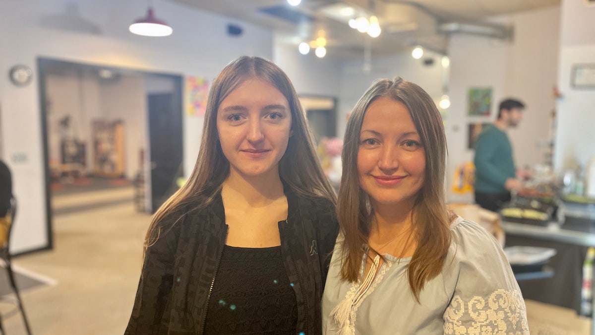 A mother and daughter from Ukraine posing together