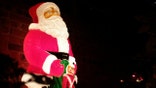A glowing statue of Santa Claus