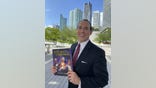 Raymond Arroyo holds new book