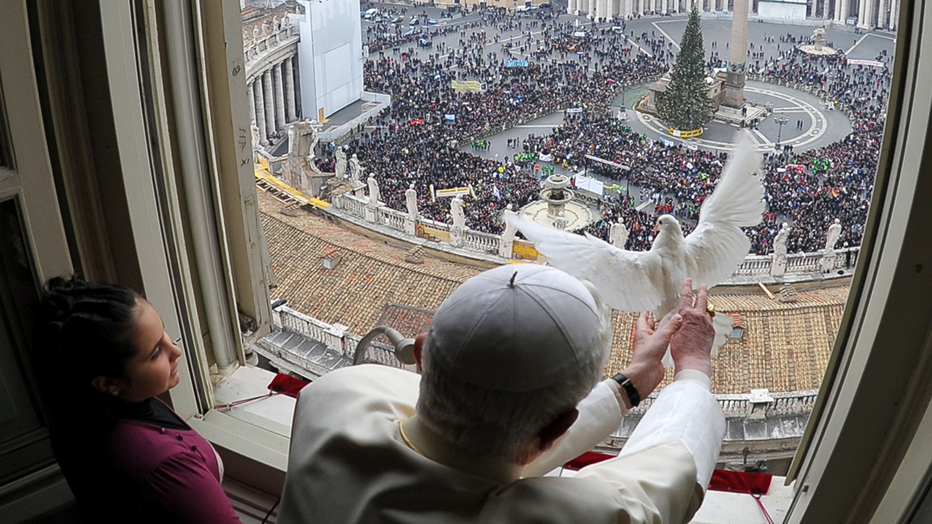 Pope Benedict releases a dove