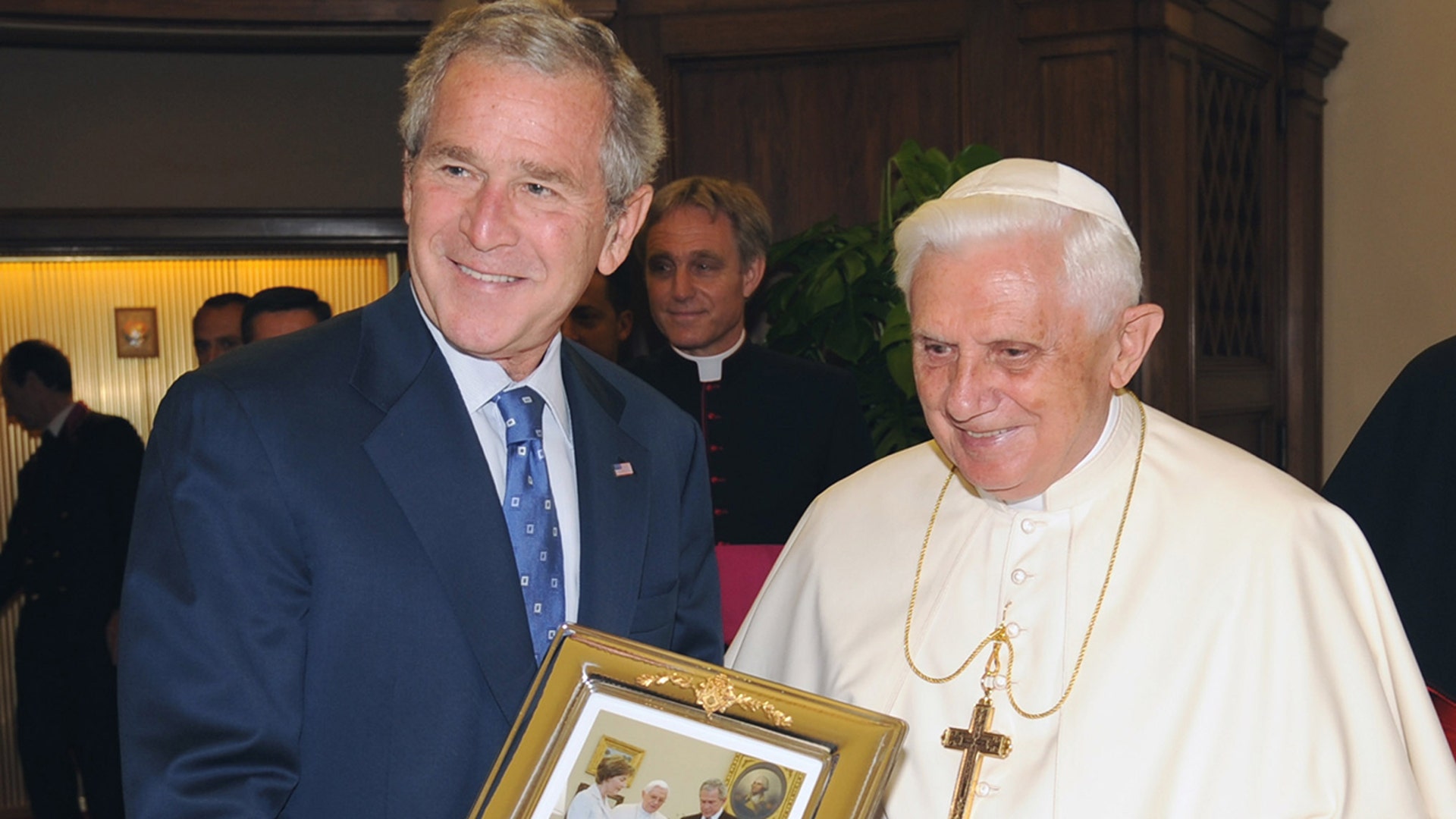 Bush with Pope Benedict holding photo