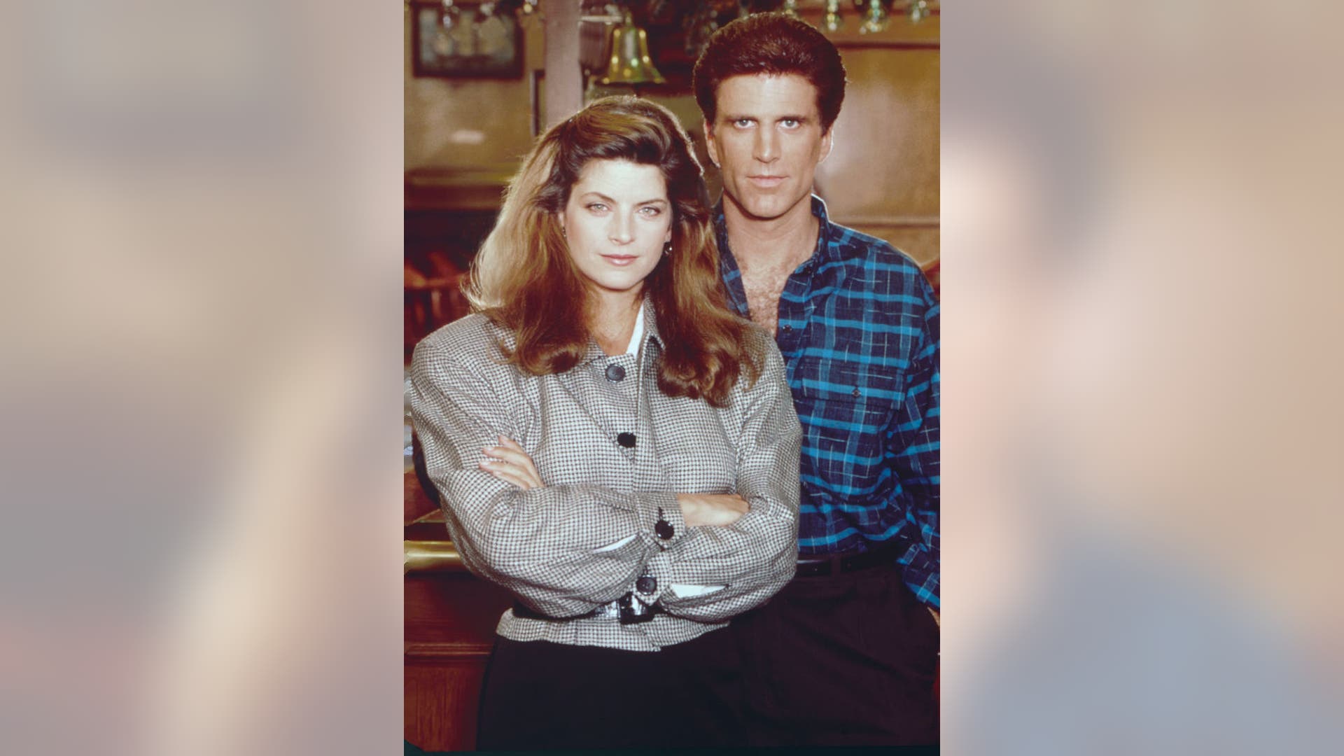 Kirstie Alley and Ted Danson pose for Cheers photos