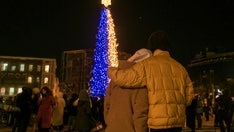 Kyiv lights Christmas tree as capital faces days without power following Russian drone strike