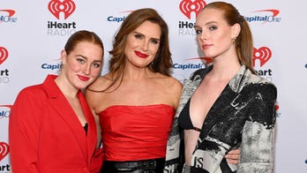 Brooke Shields, 57, rocks racy red top to JingleBall as she matches with daughters: 'A Cool Mom'