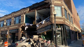 Massachusetts building's facade crumbles after car crashes into it
