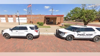 Texas woman in hazmat suit accused of leaving 'buckets of human waste' at police station