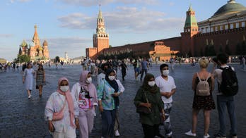 Vegan activist arrested taking her pet calf for a walk in Moscow's Red Square