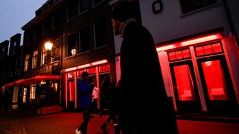 Amsterdam looks to ban red light district sex workers from windows to combat nuisance tourism