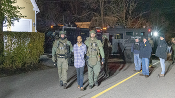 Massachusetts police identify man accused of breaking into station with chainsaw, dangling children out window