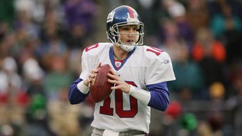 New York Giants quaterback Eli Manning speaks to the media during Media Day  at the University of Phoenix Stadium in Glendale, Arizona, on January 29,  2007. Super Bowl XLII will feature the