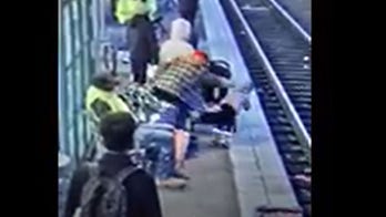 Oregon woman held without bail after video shows her allegedly pushing 3-year-old onto train tracks