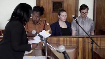 American foster parents detained in Uganda hit with new child trafficking charge that carries death penalty