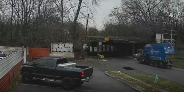 Calm before the storm: dramatic video captures the garbage truck driving along East New York Street in Indianapolis just before 8am on Monday.