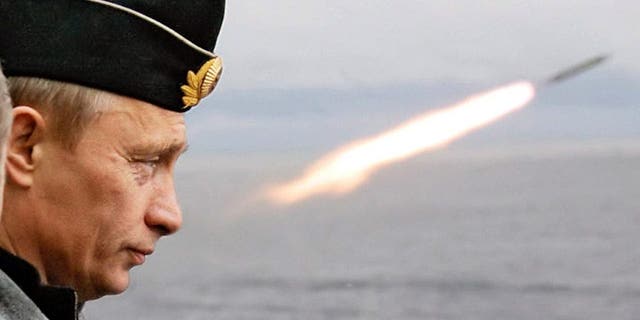 Russian President Putin watches a missile launch during naval exercises in Russia's northern Arctic aboard the nuclear-powered missile cruiser Pyotr Veliky.