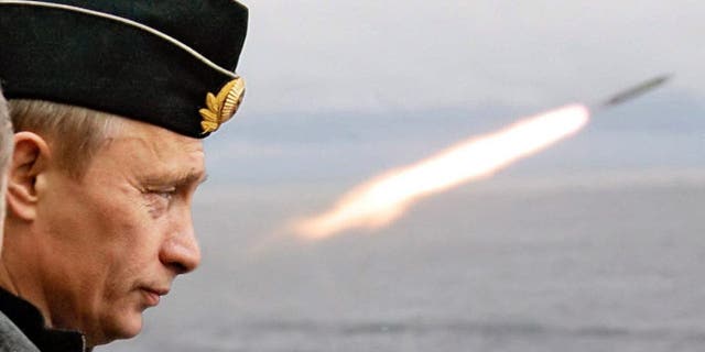 Russian President Putin watches a missile launch during naval exercises in the Russian Arctic aboard the nuclear missile cruiser Pyotr Veliky.