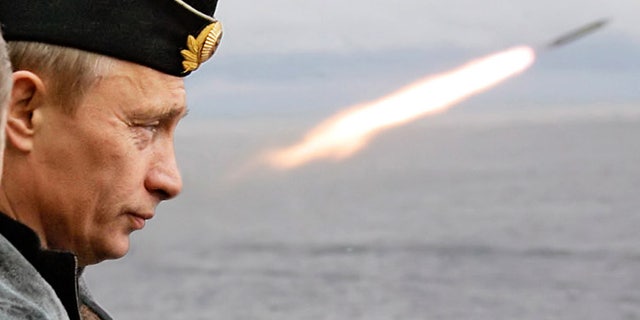Russia's President Vladimir Putin oversees the launch at sea of a ballistic missile.