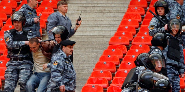 Riot police practice dispersing hooligans at Luzhniki Stadium in Moscow May 16, 2008. Moscow's Luzhniki will host the UEFA Champions League soccer final between Manchester United and Chelsea on May 21.  